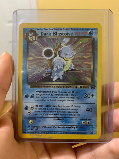Dark Blastoise 70 HP holo Pokémon trading card in protective case, held by hand